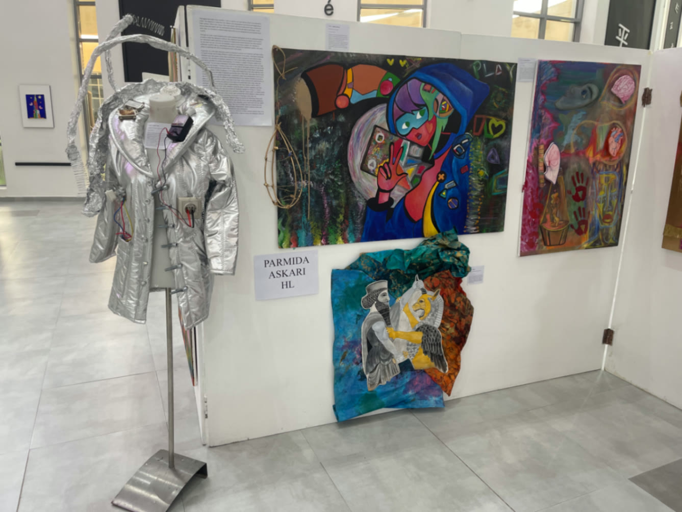 The Space Coat on stand with the painted wall
