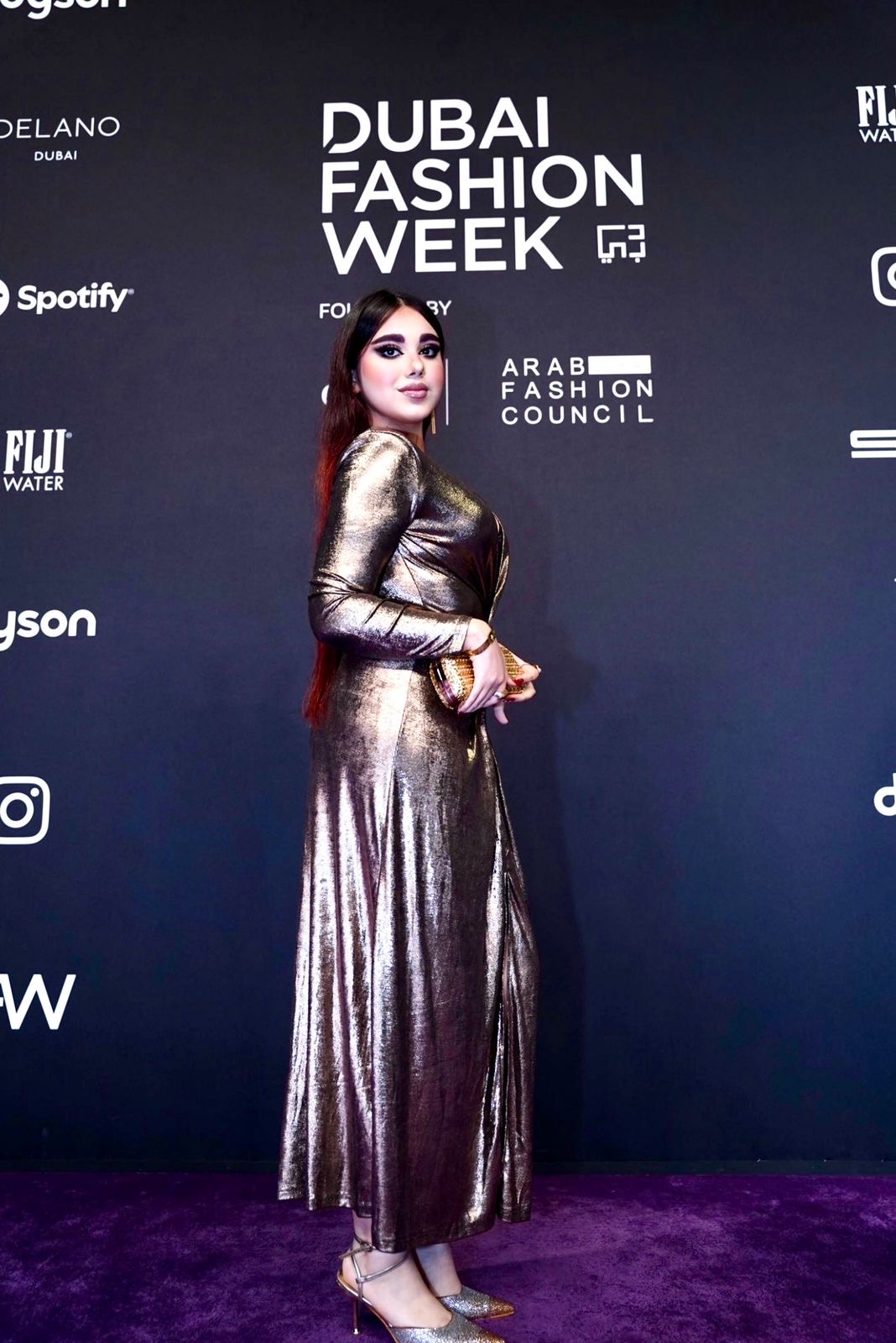 Parmida Askari at Dubai Fashion Week in a metallic gown
