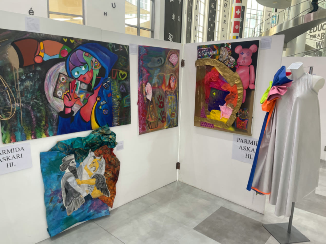 Atrium wall — Play, mixed-media panels and Persepolis